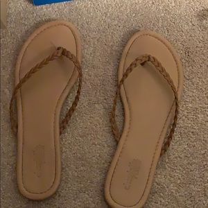 Tan braided flip flops